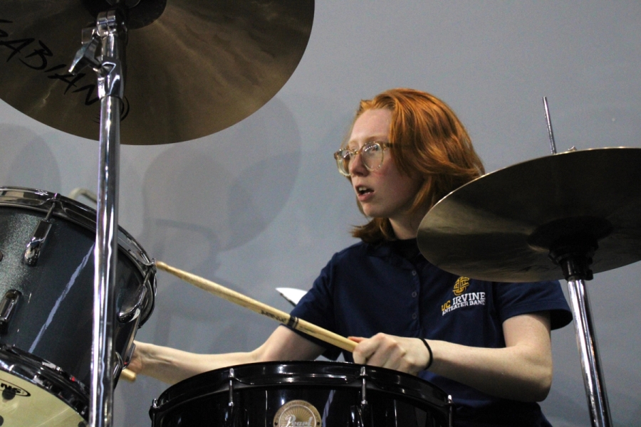 Girl playing the drums.