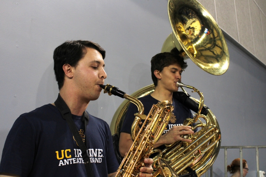 Boy playing tenor sax and boy playing tuba.