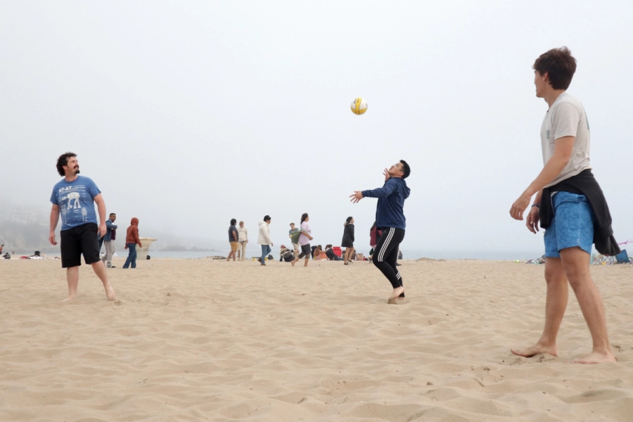 Boy about to hit volleyball.