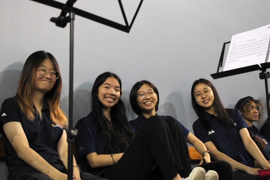 Flute section smiling.