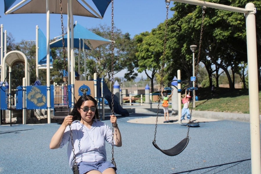 Girl in the middle of a swing.