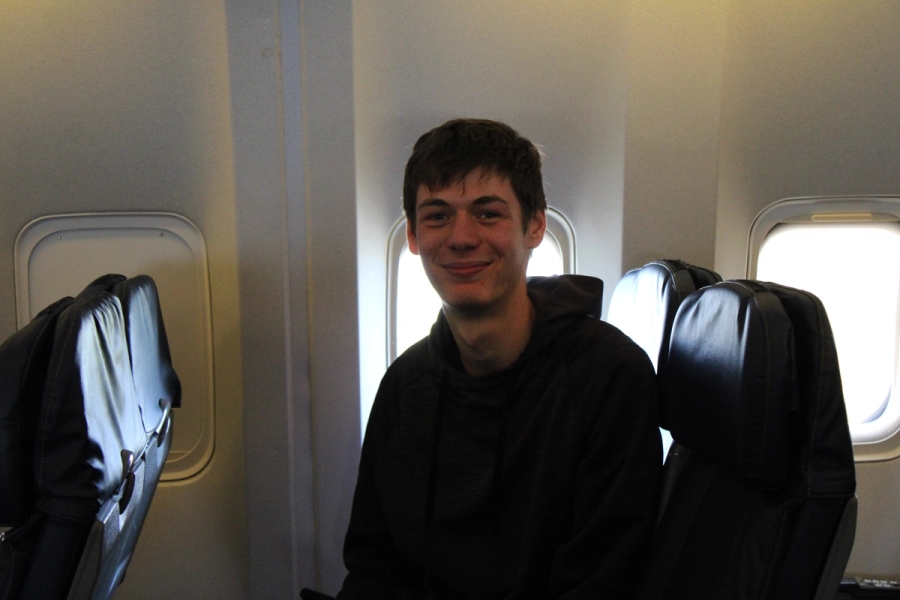 Boy stares and smiles at camera.