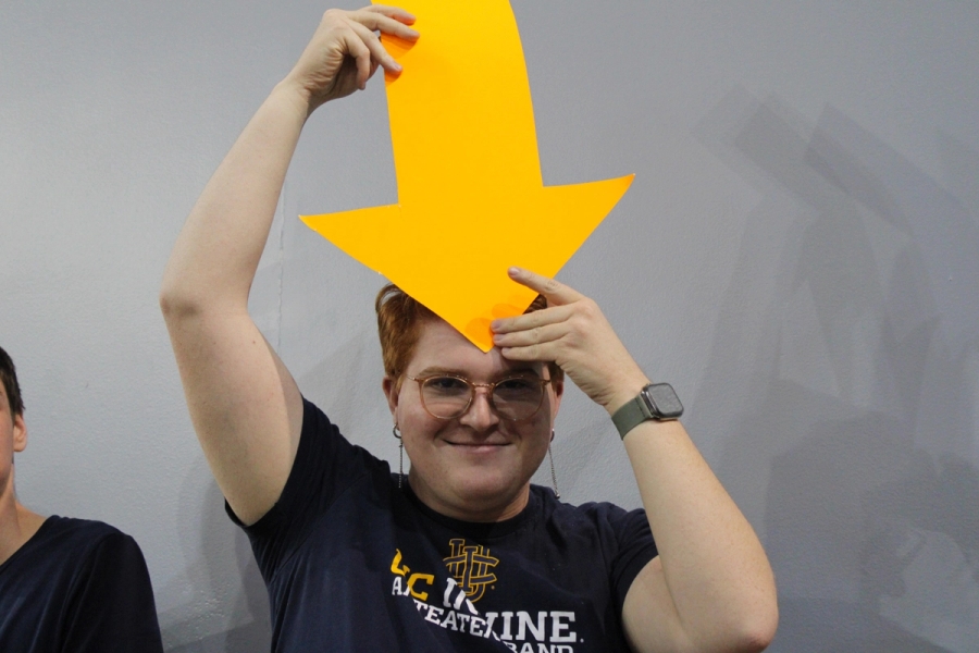 Boy with orange arrow on forehead.
