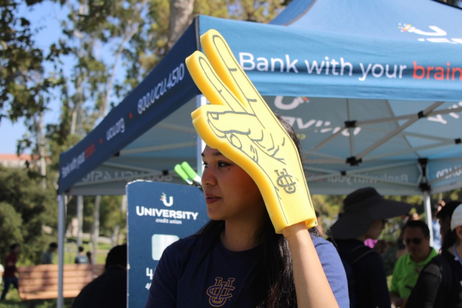 Girl holding Zot foam finger.