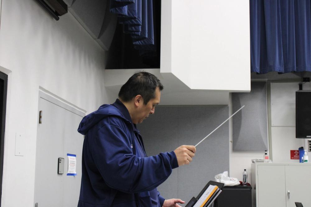 Director conducting.