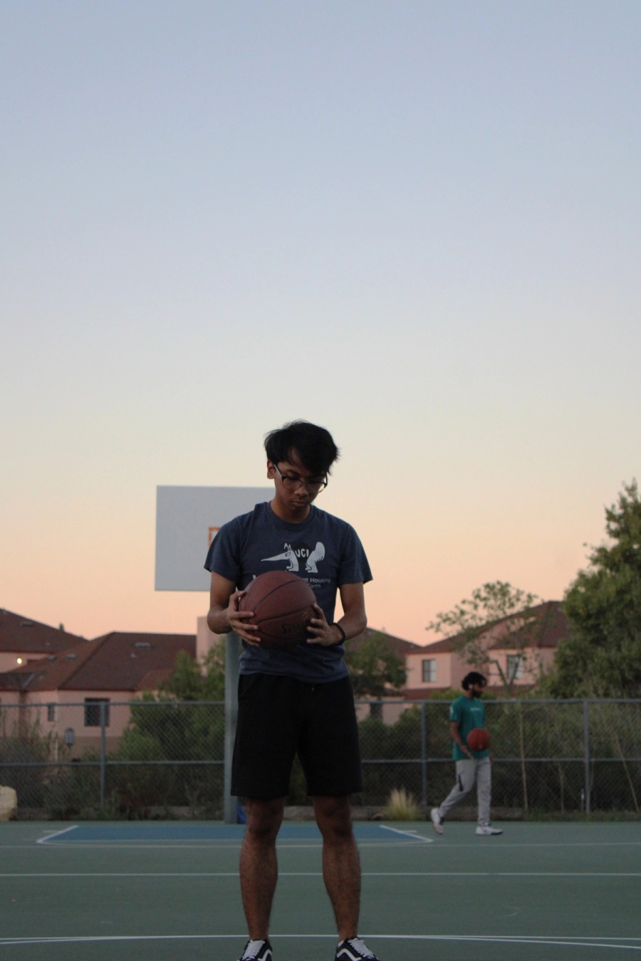 Boy holding basketball.