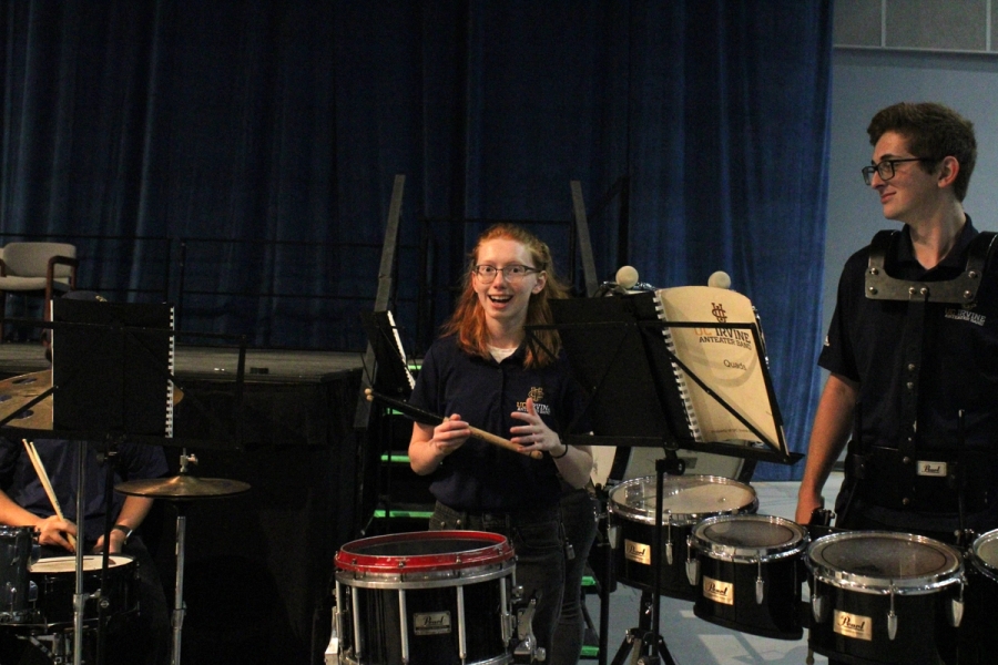 Girl in awe by the drums.