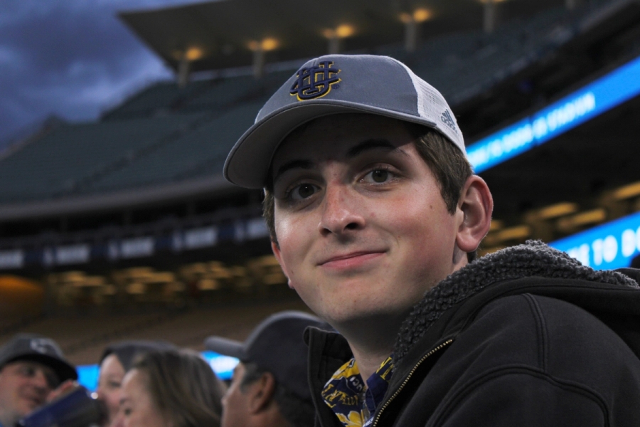 White boy smiling at camera.