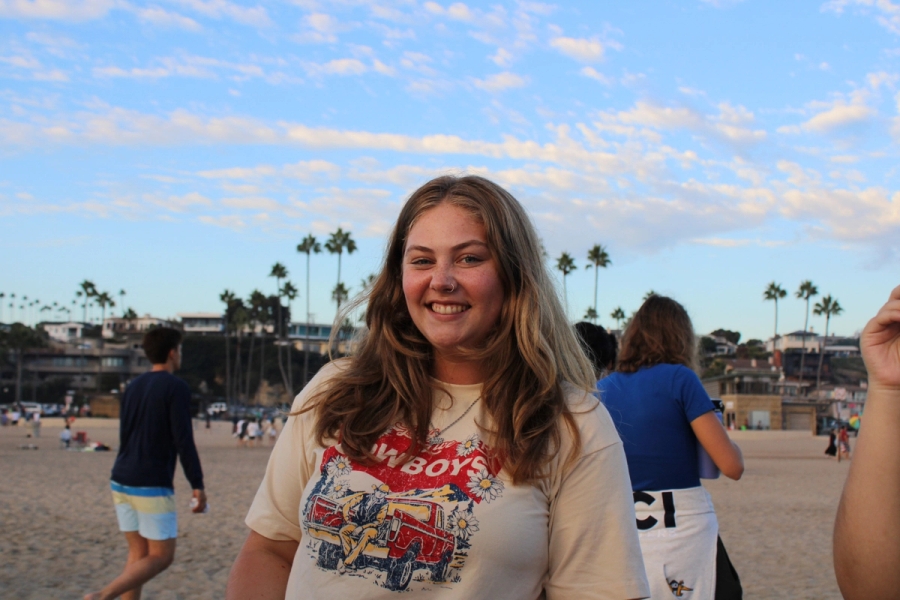Girl smiling with cowboy shirt.