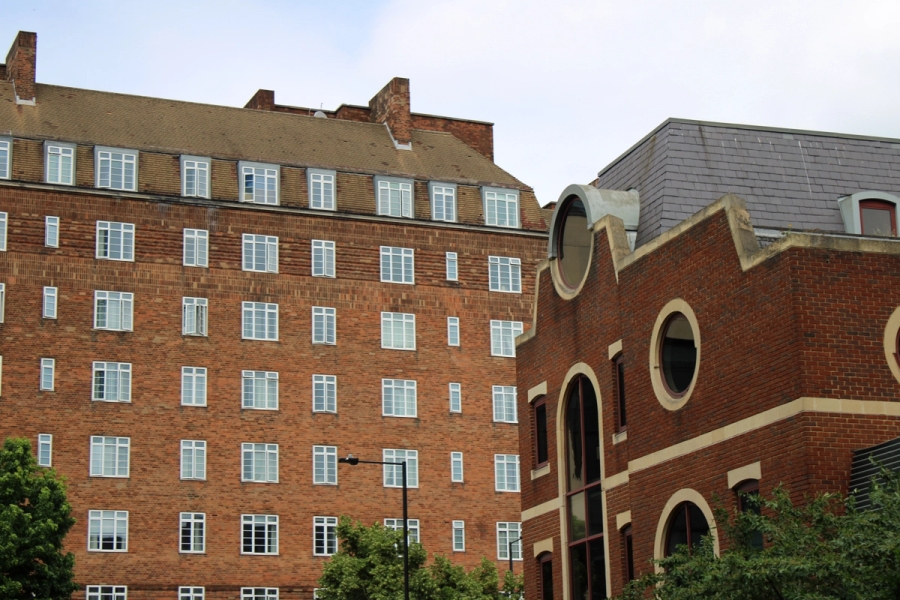 Two red bricked buildings.