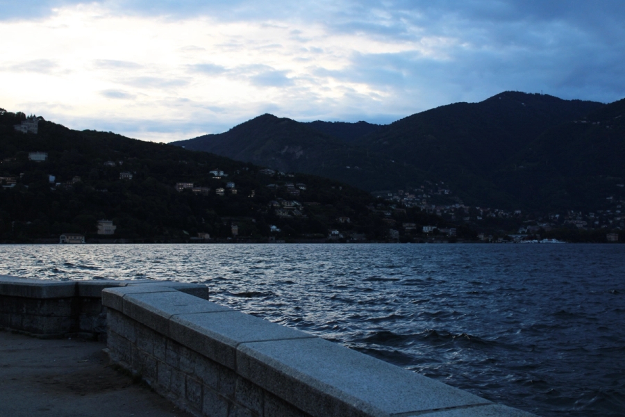Concrete ledge by lake.