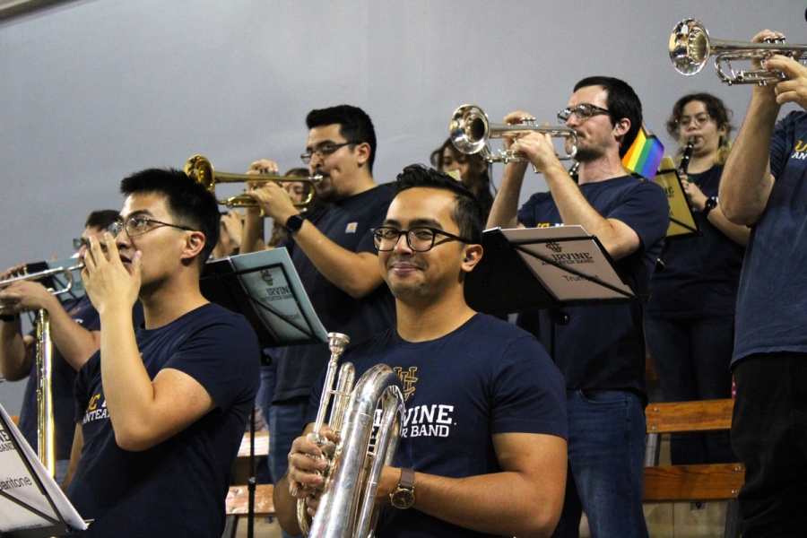 Baritone staring at camera while trumpets play.