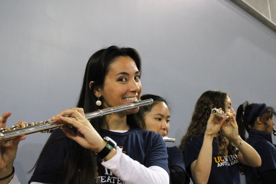 Girl smiling with flute in hand.