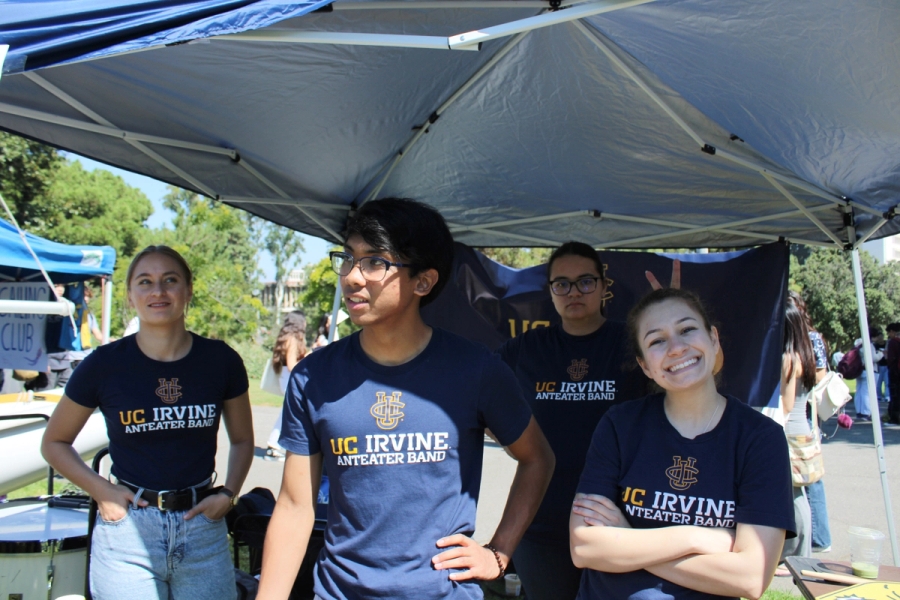 Students relaxing under shade.