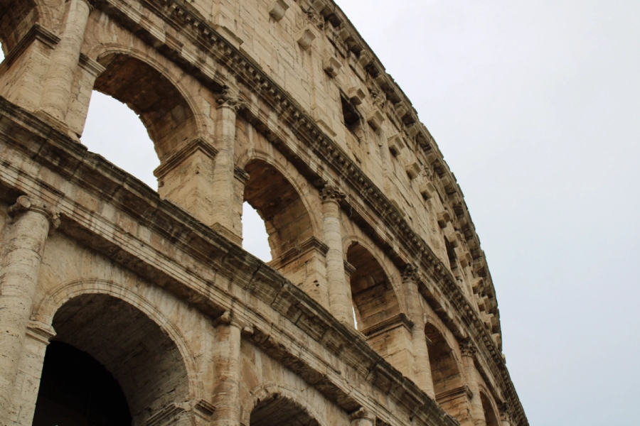 Low POV of top right of colosseum.