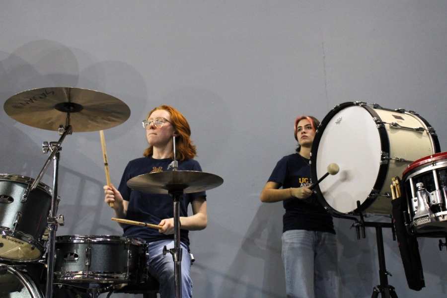 Two girls playing percussion.