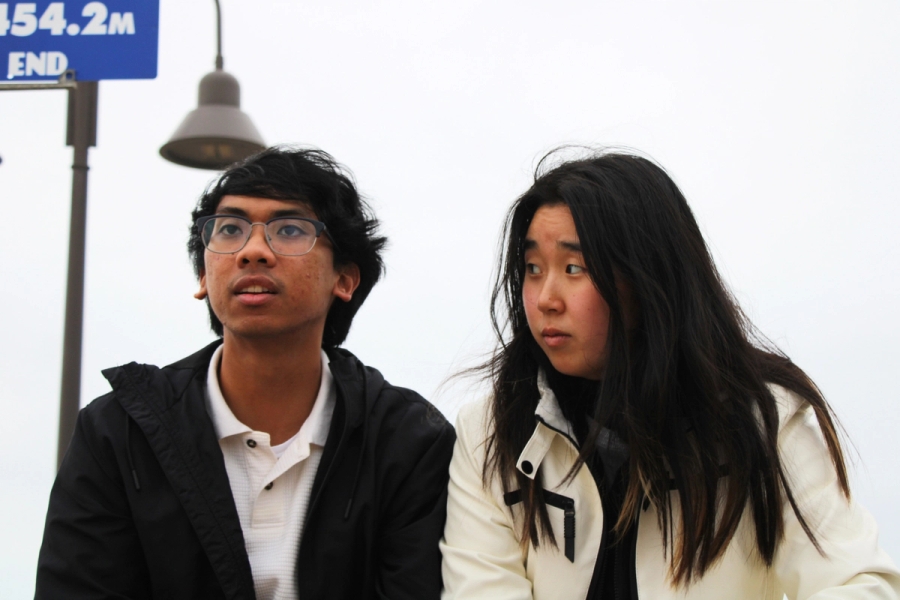 Girl staring at boy.