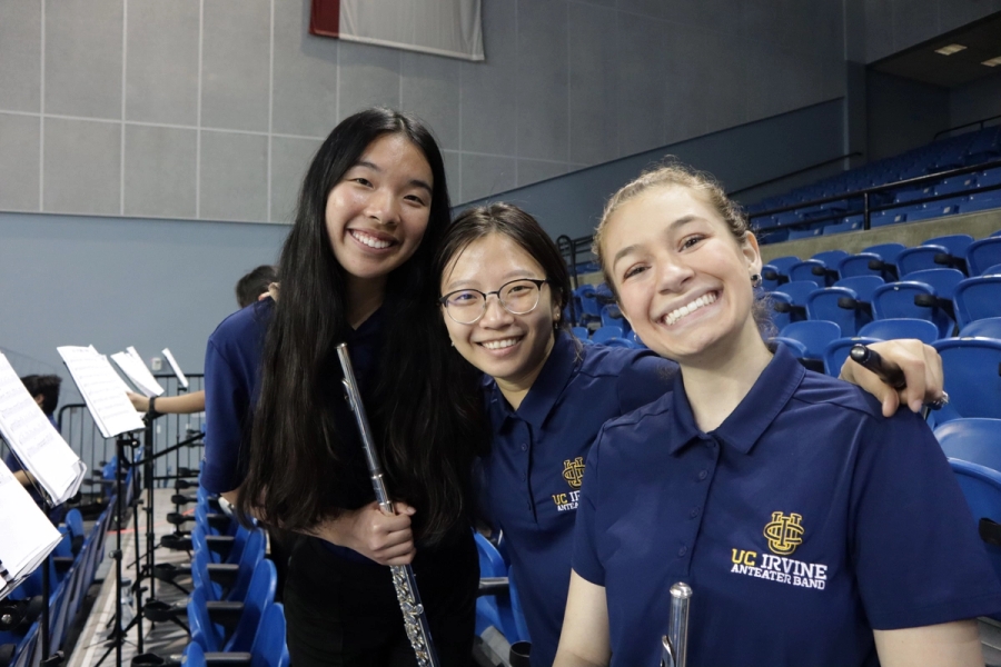 Three flute girls smiling.