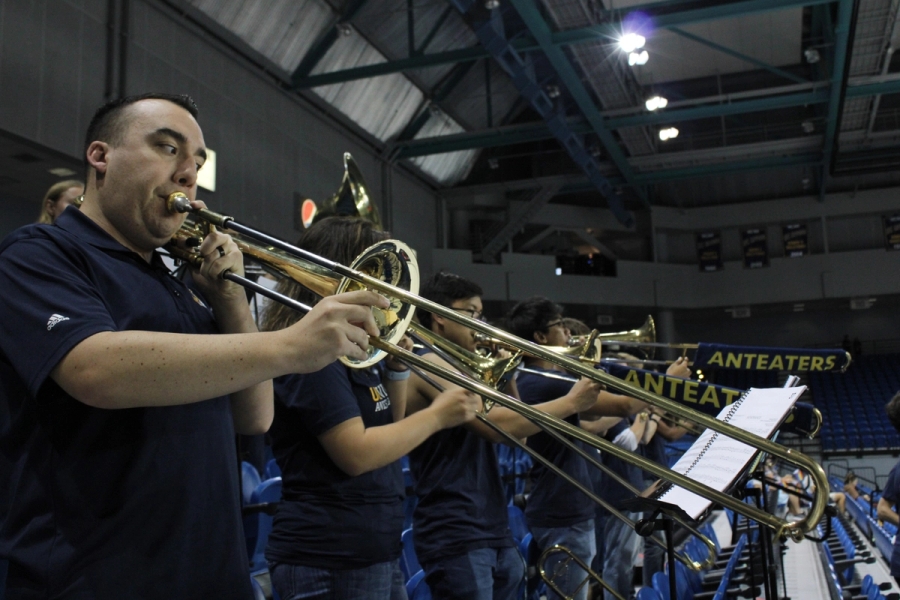 Low POV of trombones playing.