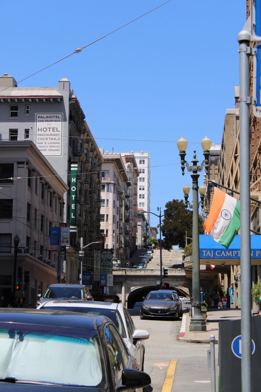 Cars on the street and some buildings.