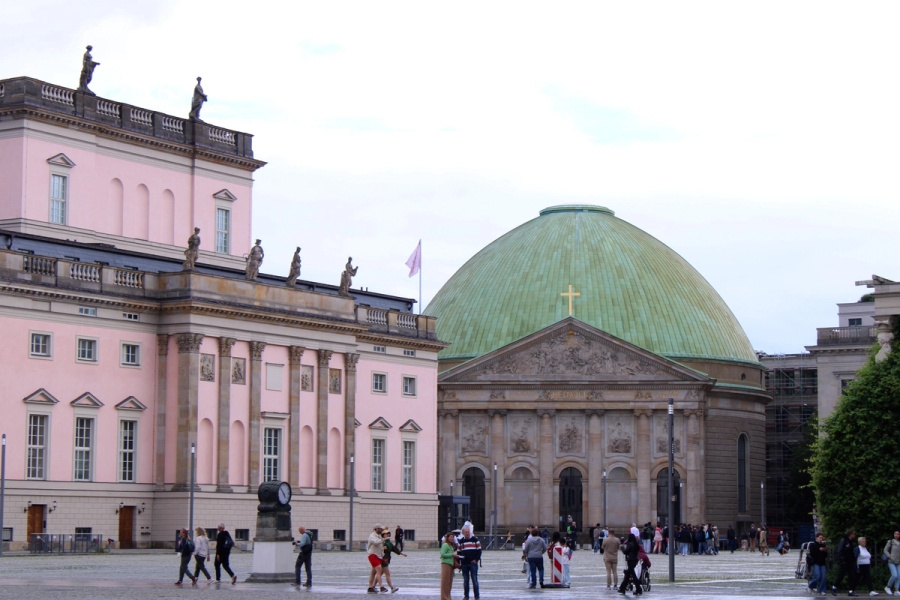 Green-domed building and pink building.