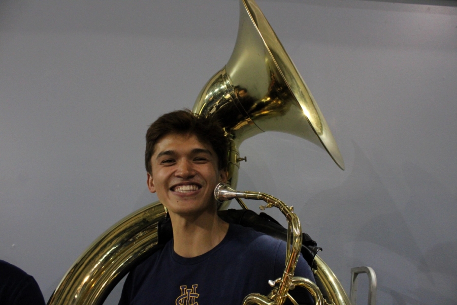 Boy smiling with tuba.