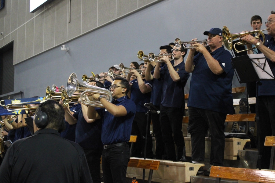 Band in polos playing.
