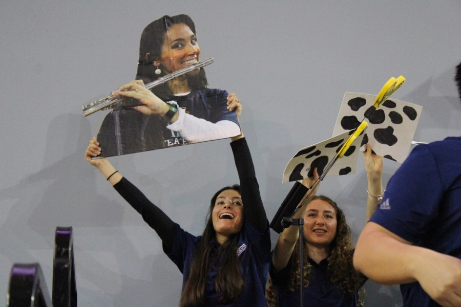Girl holding her own senior poster.