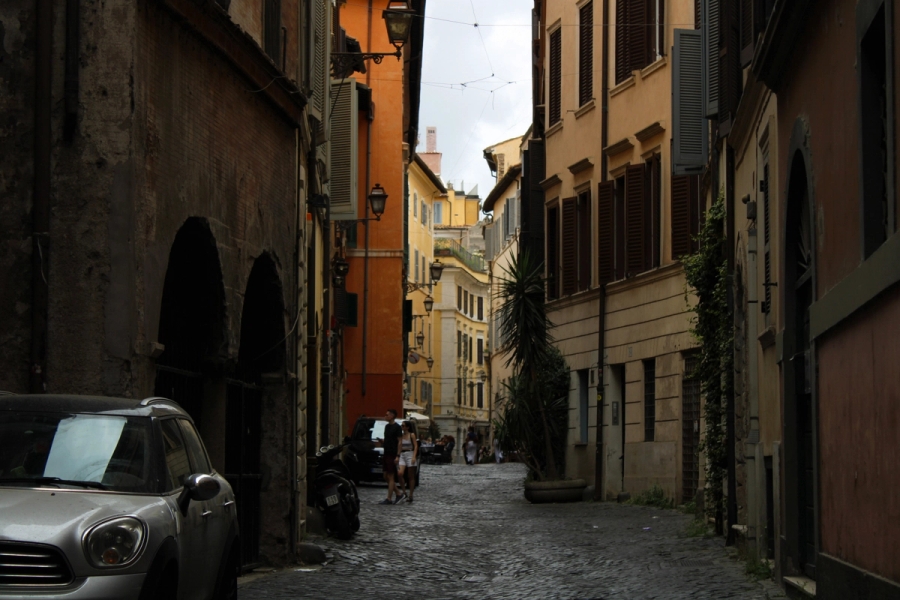 Street in between buildings in Rome.