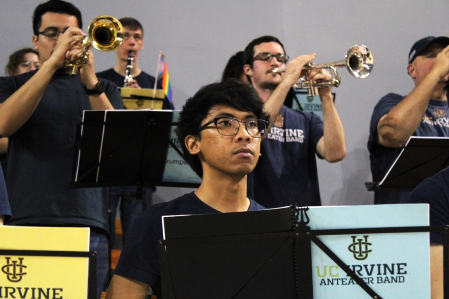 Boy staring at court in front of trumpets.
