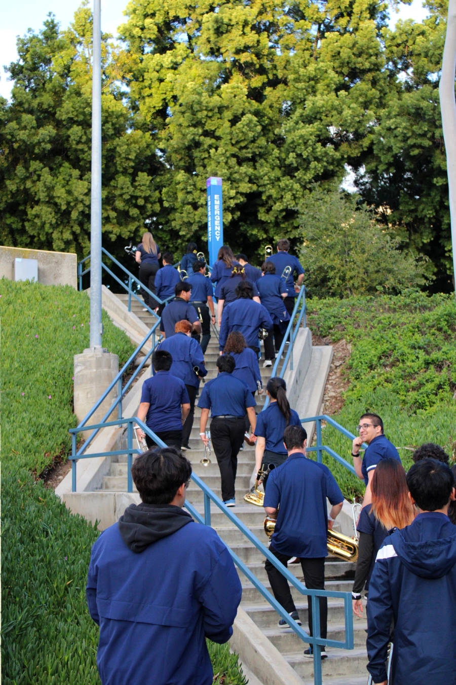 Band members walking up stairs.