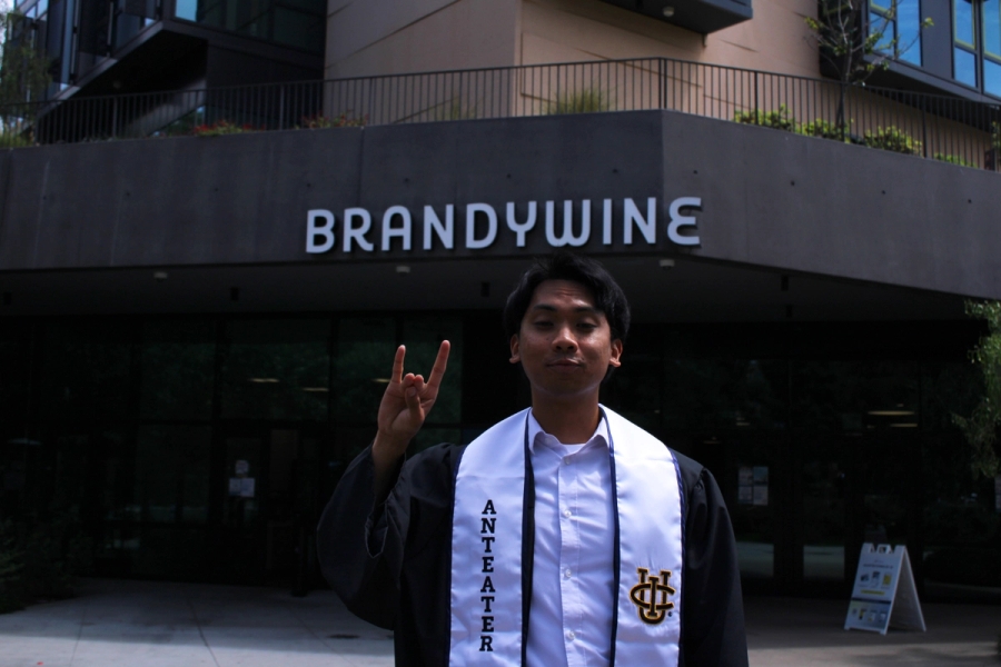 Boy zotting in grad fit.