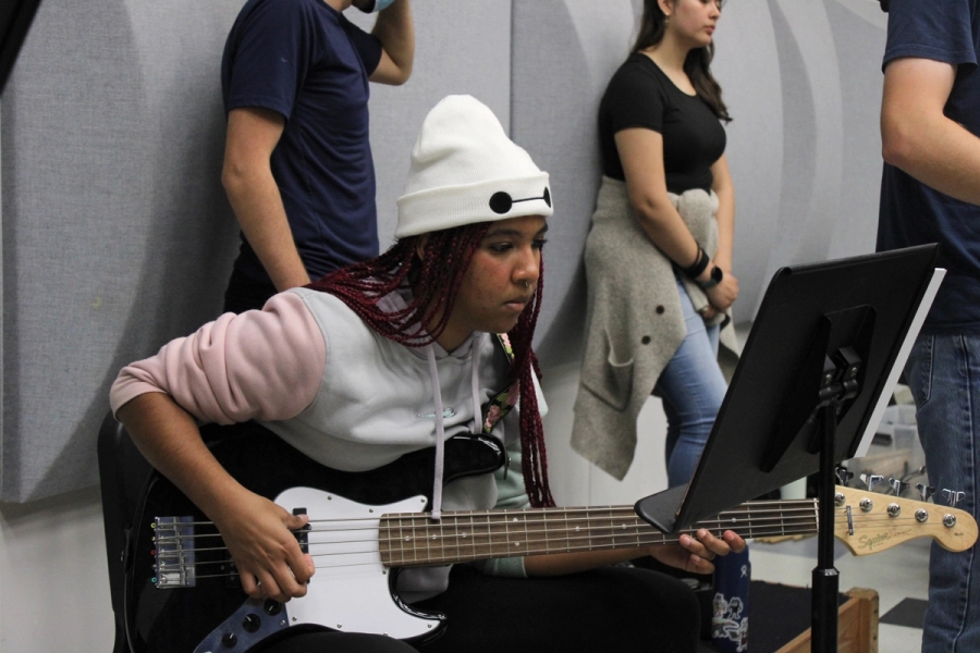 Girl playing bass.