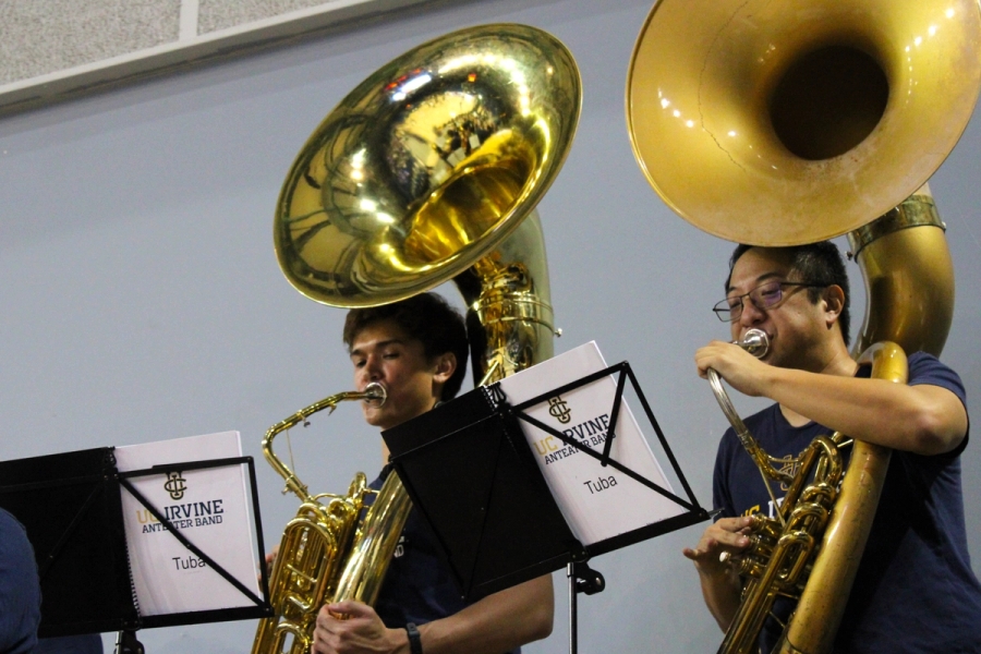Low POV of tubas playing.