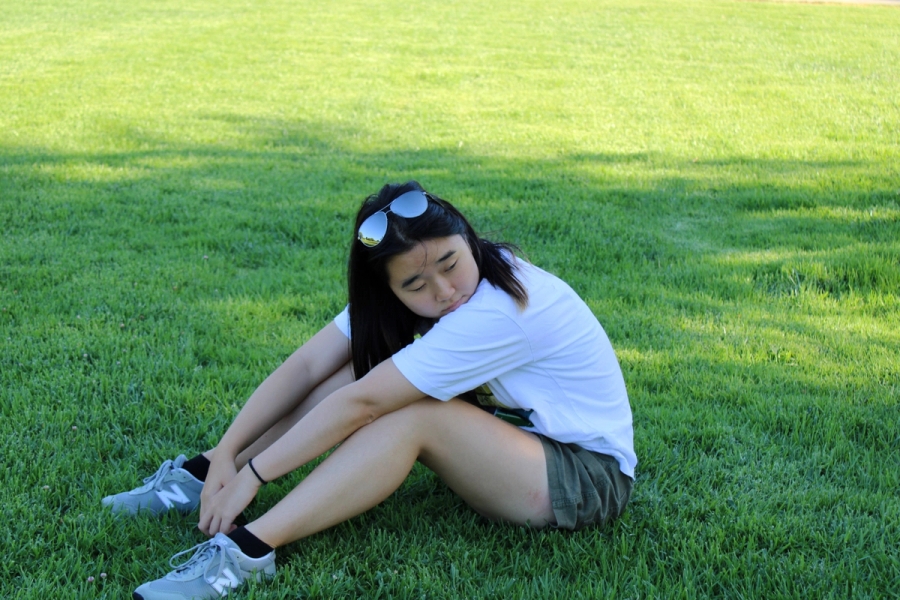 Asian girl looks to right.