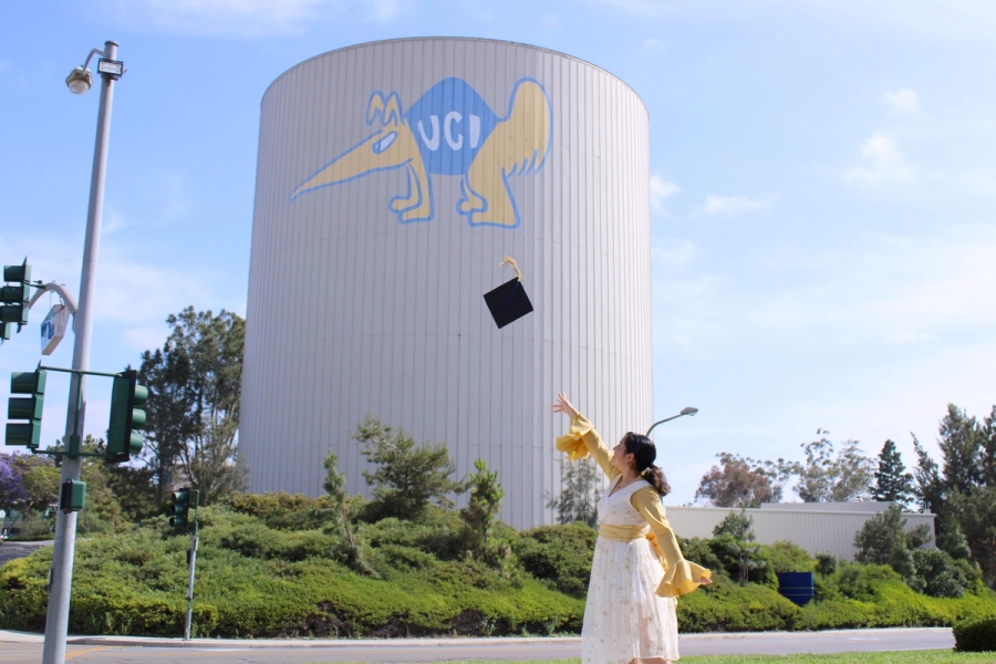 Girl throwing her grad cap.