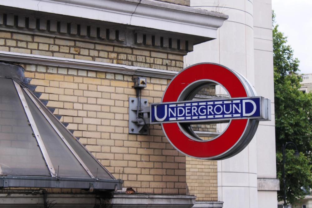 Underground sign on building.