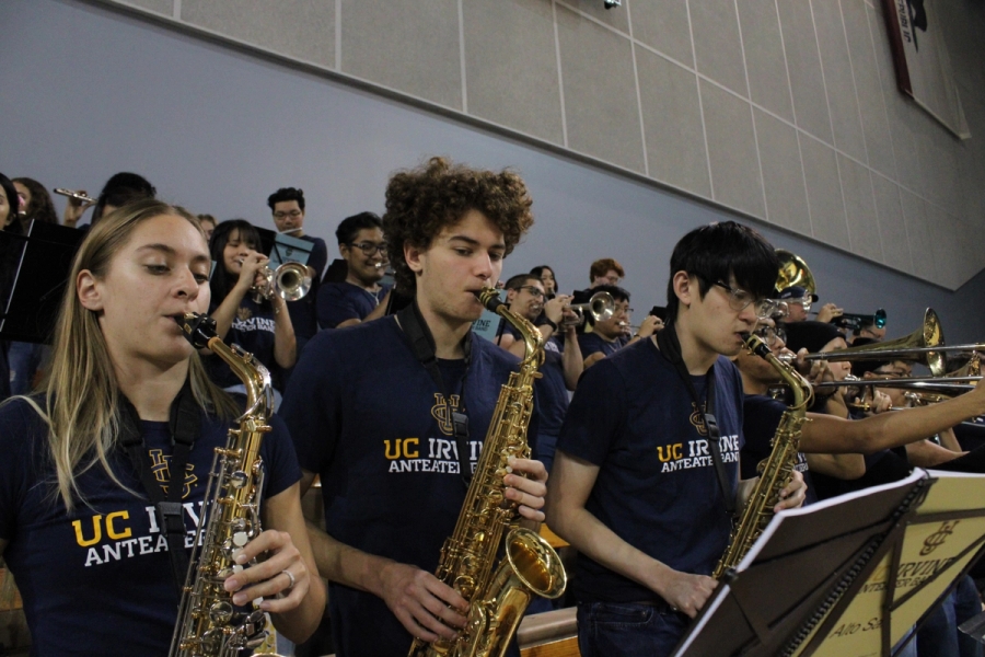 Side POV of alto saxes playing.