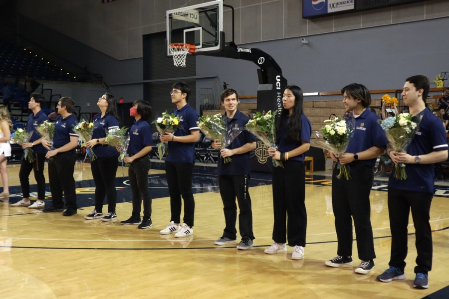 Band seniors with bouquets.