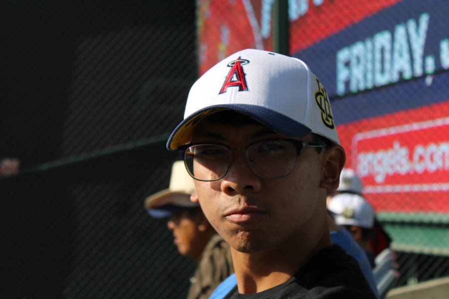 Boy staring with hat.
