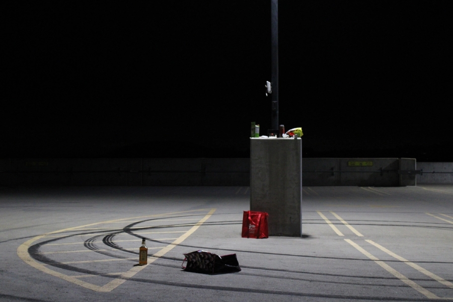 Random items scattered in a parking lot.
