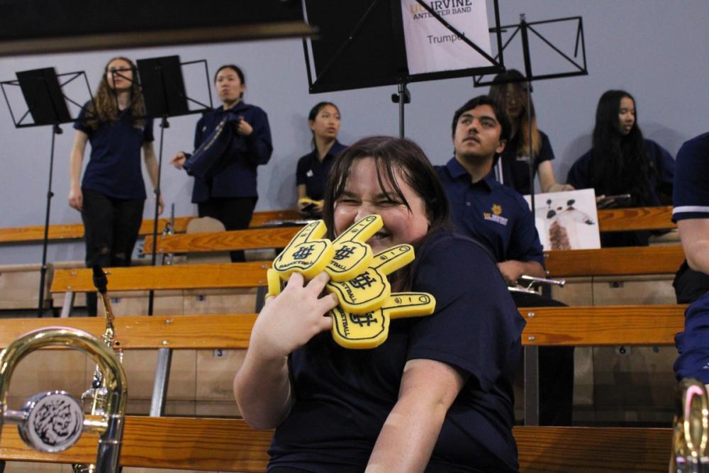 Girl with 5 Zot foam fingers.