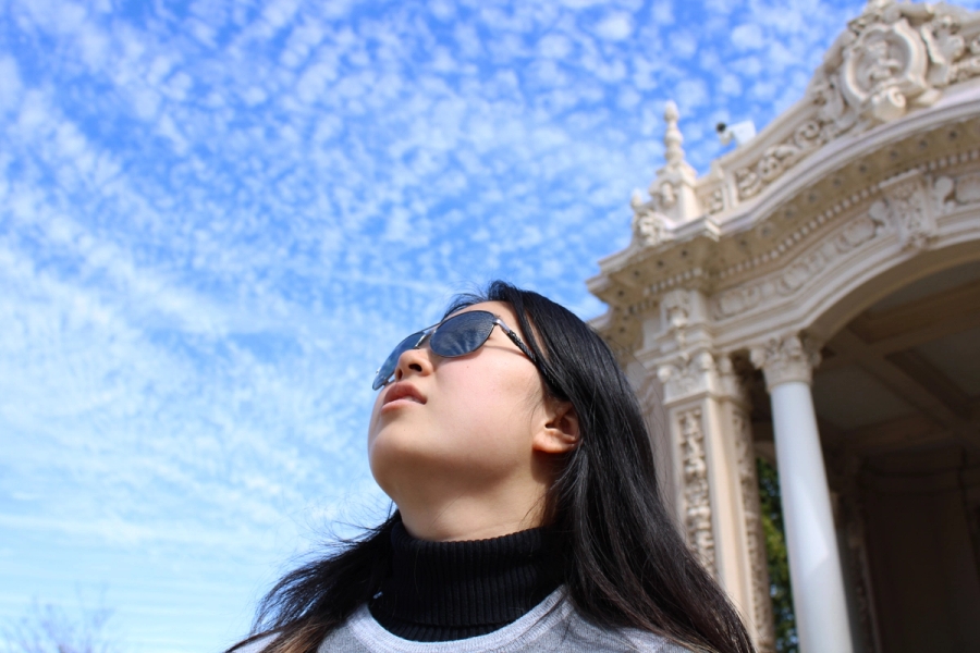 Girl staring up at the sky.