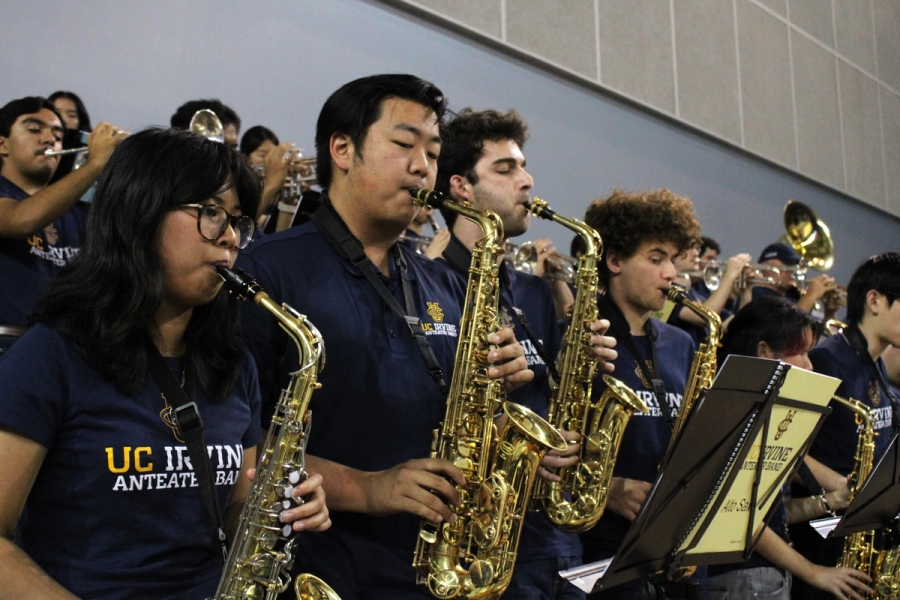 Side POV of alto saxes.