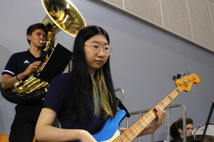 Girl playing bass.