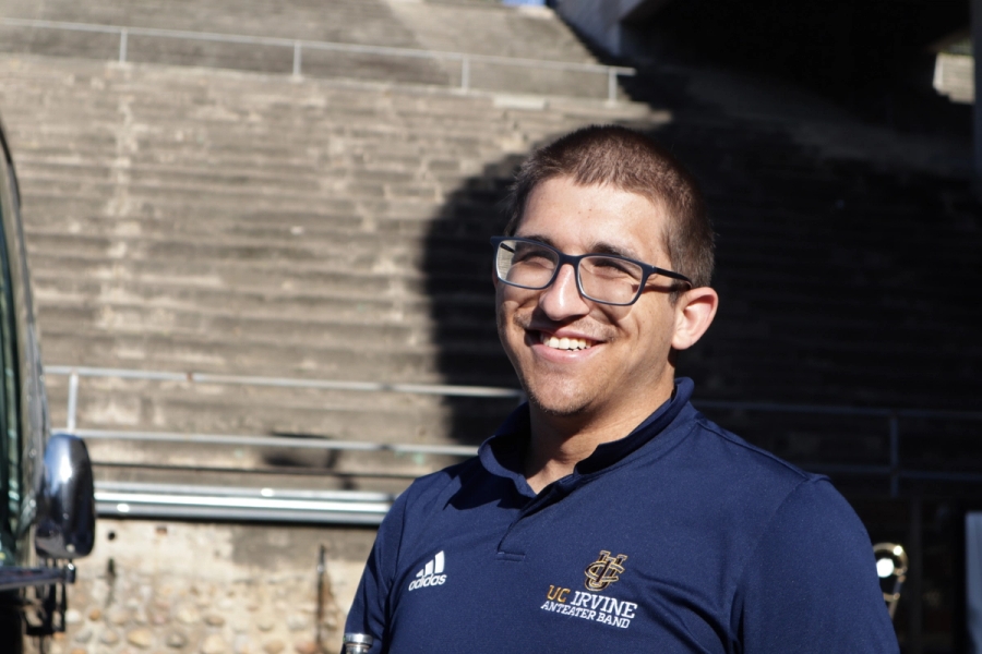 Boy with glasses smiling.