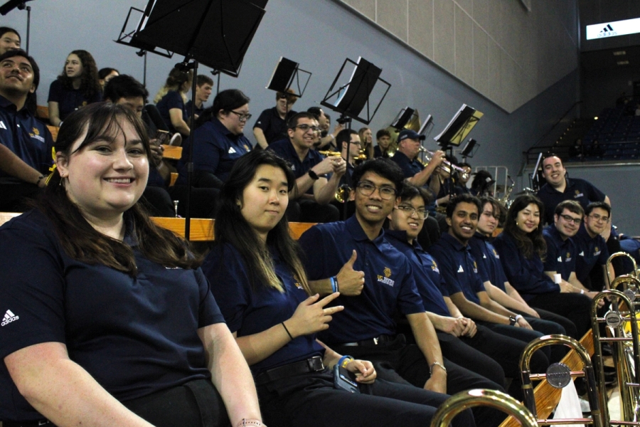 Trombone section smiling.