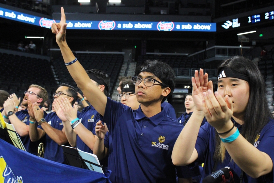 Trombones clapping and one guy holding up an L.