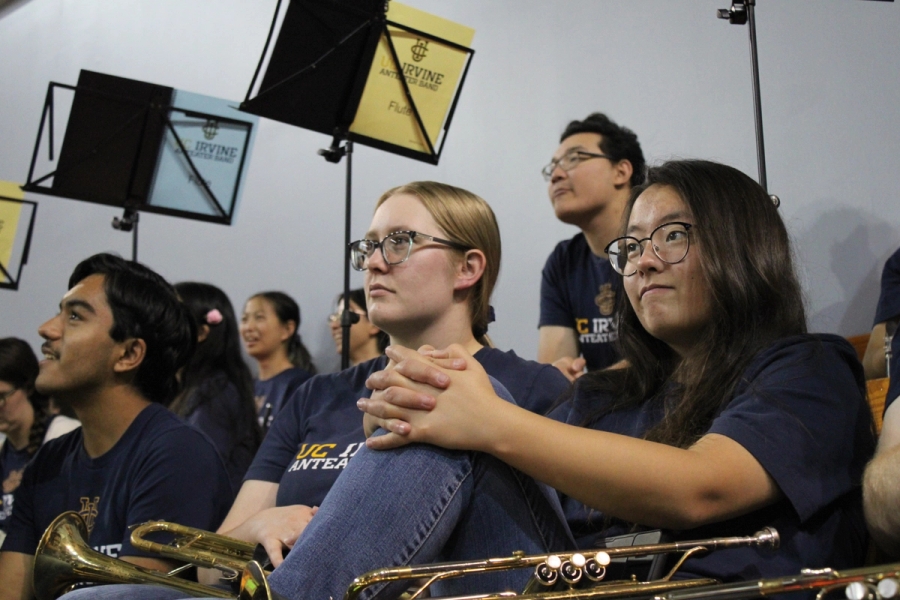 Two trumpet girls stare.