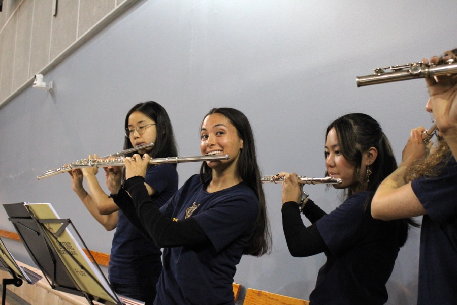 Flutes playing (and one smiling).